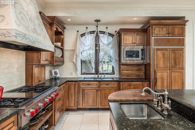 325 Rio Vista Dr, White Salmon, WA 98672 - kitchen with custom exhaust hood, built in appliances, a sink, and ornamental molding