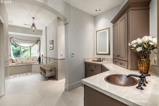 325 Rio Vista Dr, White Salmon, WA 98672 - bathroom featuring tile patterned floors, double vanity, a garden tub, and a sink