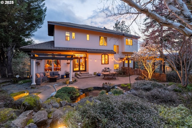 325 Rio Vista Dr, White Salmon, WA 98672 - back of house with a patio area, entry steps, a tile roof, and an outdoor living space