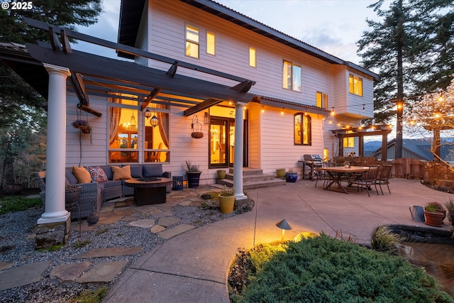 325 Rio Vista Dr, White Salmon, WA 98672 - back of house at dusk with outdoor lounge area, a patio, and a pergola