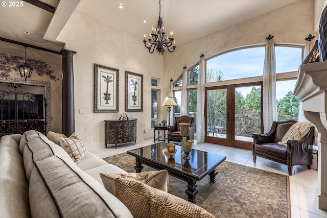 325 Rio Vista Dr, White Salmon, WA 98672 - tiled living room featuring a high ceiling, french doors, a notable chandelier, and baseboards