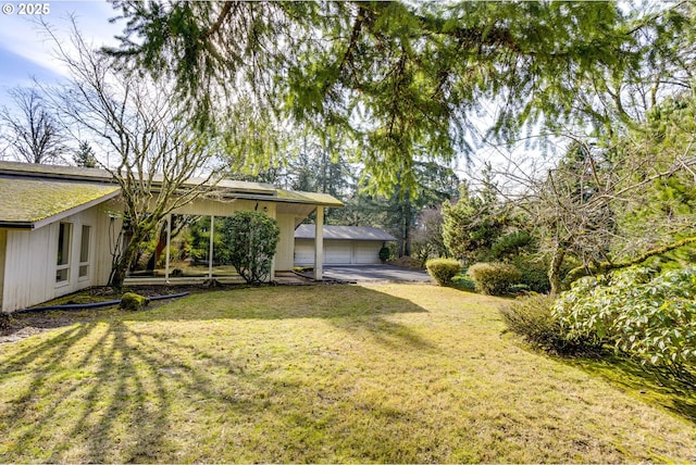 view of yard featuring a garage