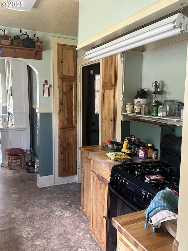 45 S 12th St, Cottage Grove, OR 97424 - kitchen featuring gas stove and arched walkways