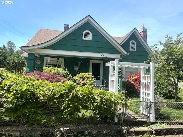 45 S 12th St, Cottage Grove, OR 97424 - shotgun-style home with a chimney, a shingled roof, and a porch