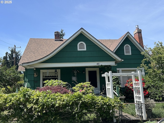 45 S 12th St, Cottage Grove, OR 97424 - view of front facade with a chimney, a shingled roof, and covered porch