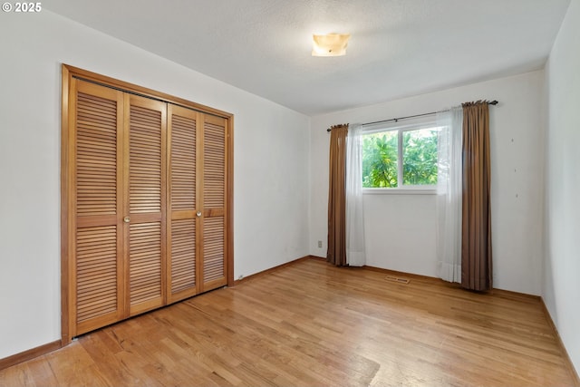 6395 SW Wilson Ave, Beaverton, OR 97008 - unfurnished bedroom with light wood-type flooring and a closet