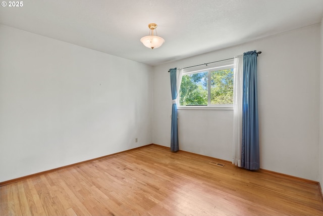 6395 SW Wilson Ave, Beaverton, OR 97008 - empty room featuring light wood-style floors