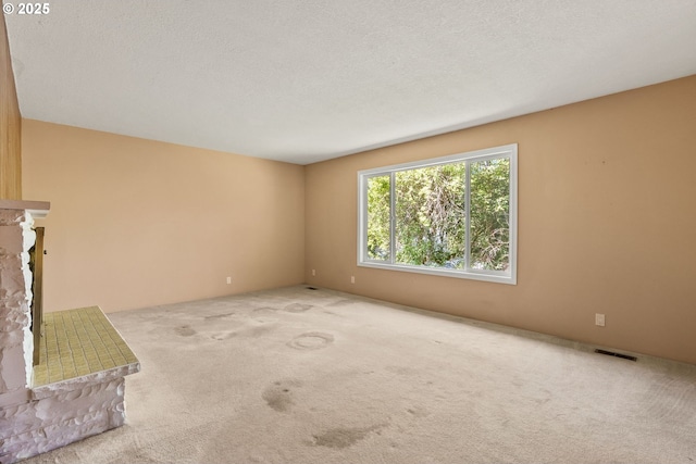 6395 SW Wilson Ave, Beaverton, OR 97008 - unfurnished living room featuring carpet and a fireplace