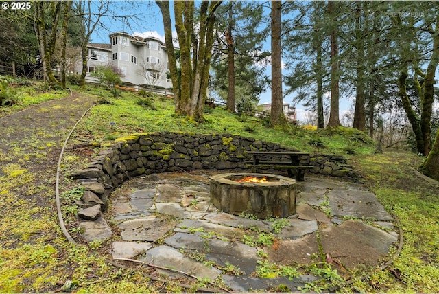 view of yard with a patio and a fire pit