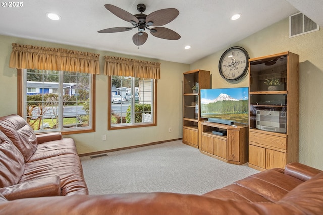 living room featuring ceiling fan and light colored carpet