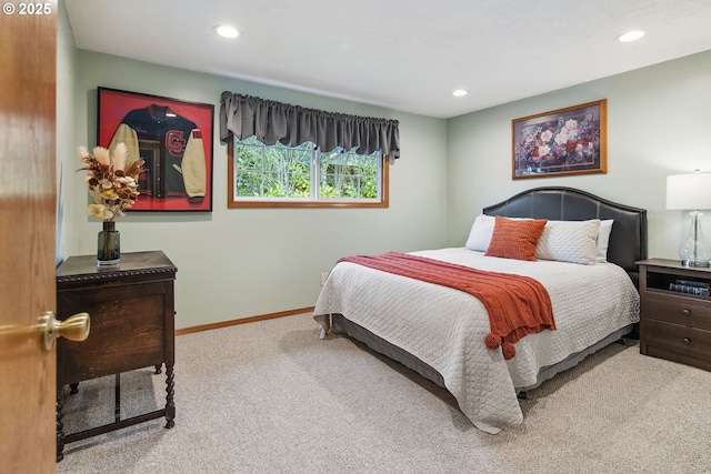 bedroom featuring light carpet