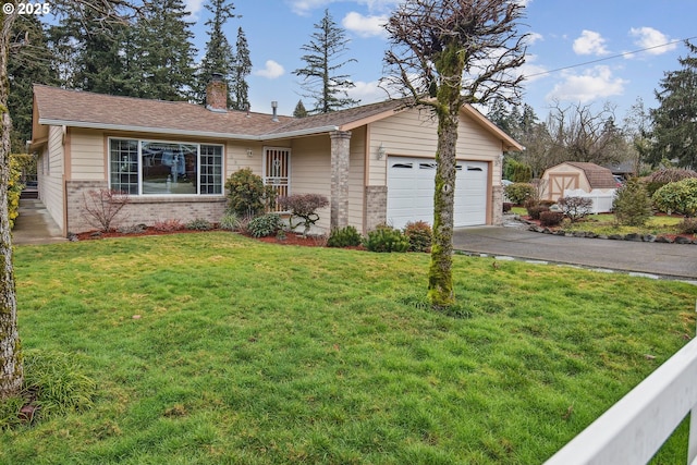 ranch-style house with a garage and a front lawn