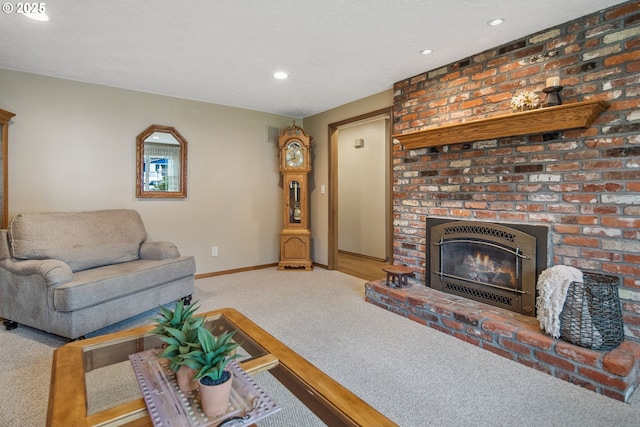 living room featuring carpet flooring, a fireplace, and a textured ceiling