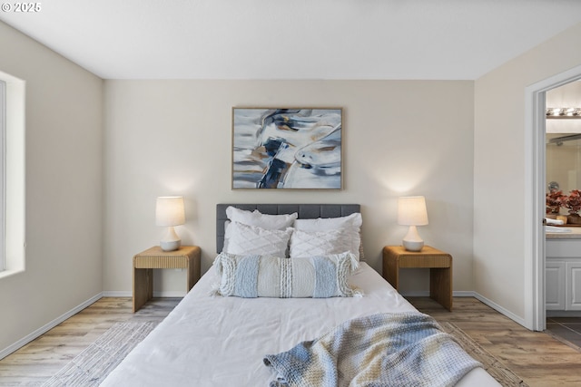 17848 SW Eldred Ln, Sherwood, OR 97140 - bedroom featuring wood finished floors, baseboards, and connected bathroom