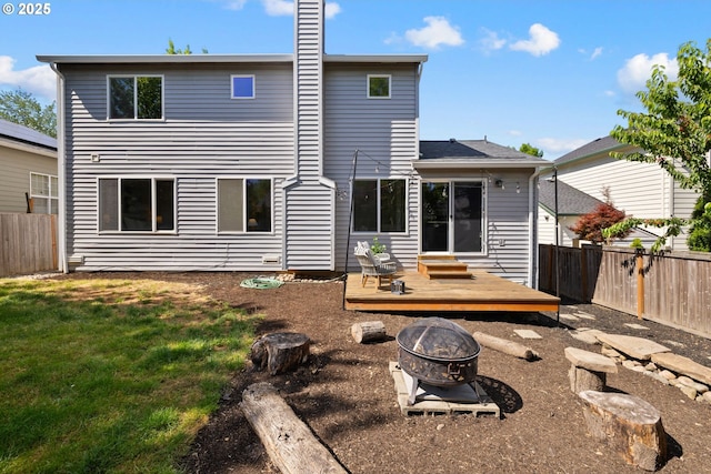 17848 SW Eldred Ln, Sherwood, OR 97140 - back of house with an outdoor fire pit, a wooden deck, and a chimney