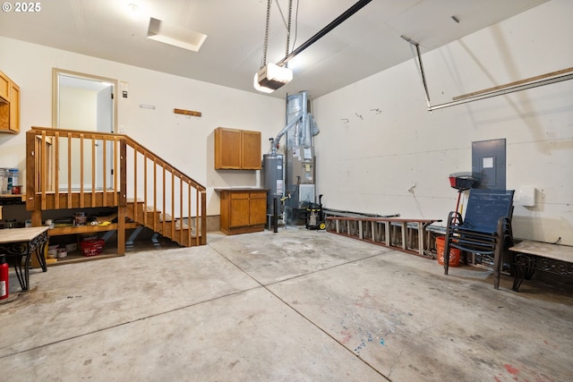 17848 SW Eldred Ln, Sherwood, OR 97140 - garage featuring a workshop area, electric panel, a garage door opener, and water heater