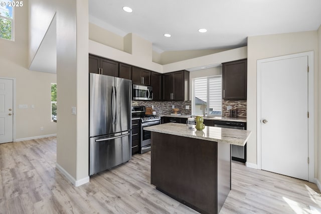17848 SW Eldred Ln, Sherwood, OR 97140 - kitchen with appliances with stainless steel finishes, backsplash, dark brown cabinets, plenty of natural light, and recessed lighting