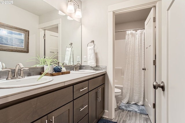 4747 S 17th Dr, Ridgefield, WA 98642 - bathroom featuring double vanity, shower / bath combination with curtain, a sink, and toilet