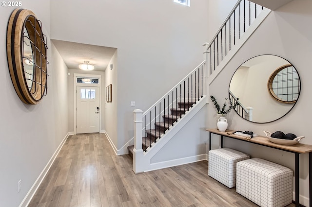 4747 S 17th Dr, Ridgefield, WA 98642 - foyer featuring stairway, baseboards, and wood finished floors