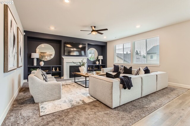 4747 S 17th Dr, Ridgefield, WA 98642 - living area featuring baseboards, ceiling fan, recessed lighting, wood finished floors, and a glass covered fireplace