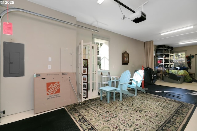 garage with a garage door opener and electric panel