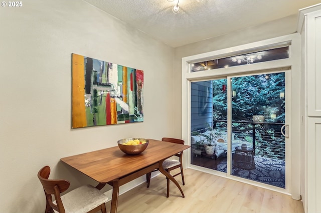 9480 SW 153rd Ave, Beaverton, OR 97007 - dining room featuring light wood-type flooring and a textured ceiling