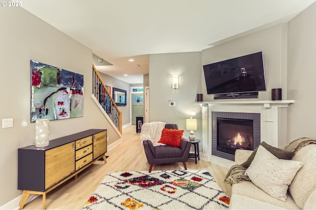 9480 SW 153rd Ave, Beaverton, OR 97007 - living room with stairs, wood finished floors, a fireplace, baseboards, and recessed lighting