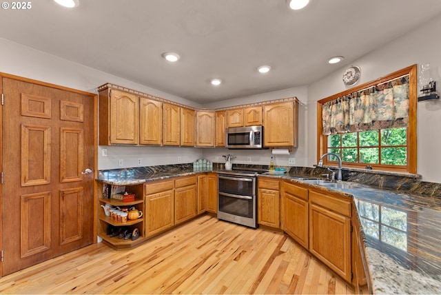 7654 N Bank Rd, Roseburg, OR 97470 - kitchen with appliances with stainless steel finishes, light wood-style floors, a sink, recessed lighting, and open shelves