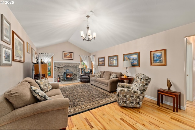 7654 N Bank Rd, Roseburg, OR 97470 - living room featuring hardwood / wood-style floors, a chandelier, lofted ceiling, and baseboards
