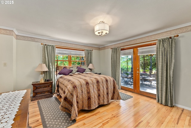 7654 N Bank Rd, Roseburg, OR 97470 - bedroom featuring ornamental molding, access to exterior, multiple windows, french doors, and light wood-style floors