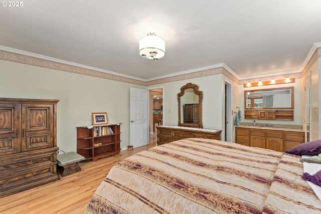 7654 N Bank Rd, Roseburg, OR 97470 - bedroom with ornamental molding, light wood finished floors, a sink, and ensuite bath