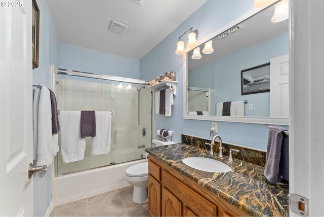 7654 N Bank Rd, Roseburg, OR 97470 - bathroom featuring toilet, vanity, shower / bath combination with glass door, and tile patterned flooring