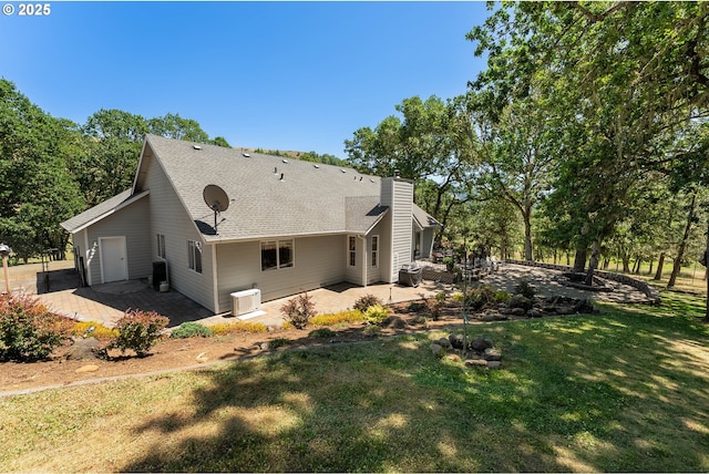 7654 N Bank Rd, Roseburg, OR 97470 - view of side of home featuring a patio area and a yard