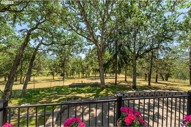 7654 N Bank Rd, Roseburg, OR 97470 - balcony featuring view of wooded area