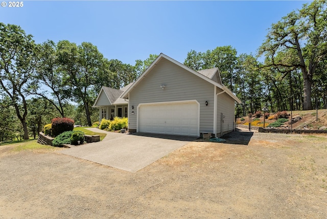 7654 N Bank Rd, Roseburg, OR 97470 - view of property exterior featuring driveway and an attached garage