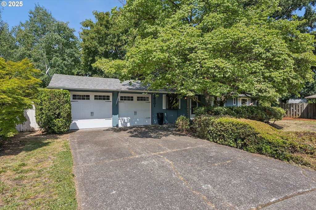 16301 SE Franklin St, Portland, OR 97236 - view of front facade featuring a garage and concrete driveway