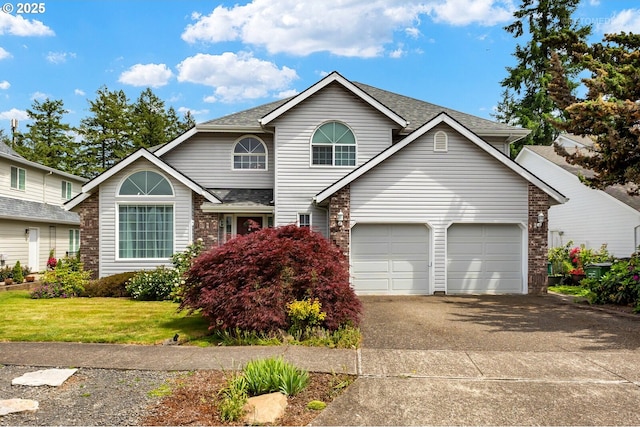 2136 N Thorne St, Newberg, OR 97132 - traditional-style house with driveway, a front lawn, a garage, roof with shingles, and brick siding