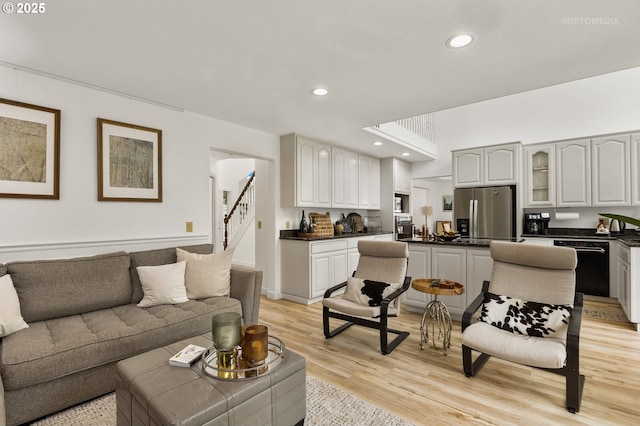 2136 N Thorne St, Newberg, OR 97132 - living area featuring light wood finished floors, recessed lighting, and stairway