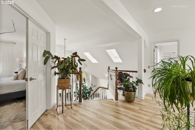 2136 N Thorne St, Newberg, OR 97132 - corridor with a skylight, wood finished floors, an upstairs landing, and recessed lighting