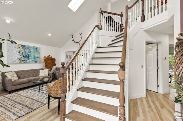 2136 N Thorne St, Newberg, OR 97132 - stairway with wood finished floors, recessed lighting, high vaulted ceiling, and baseboards