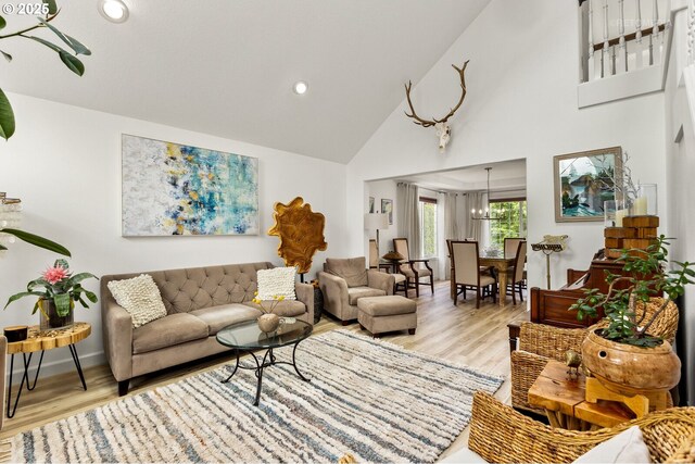 2136 N Thorne St, Newberg, OR 97132 - living area with light wood finished floors, high vaulted ceiling, recessed lighting, and baseboards