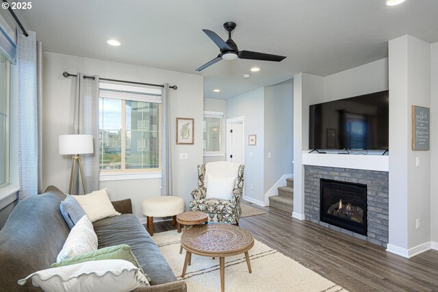 living room with a ceiling fan, baseboards, recessed lighting, and wood finished floors