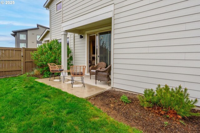 exterior space with a yard, fence, and a patio area