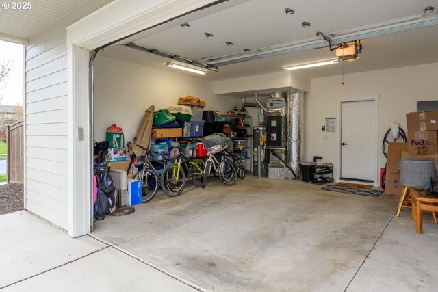 garage featuring a garage door opener and gas water heater