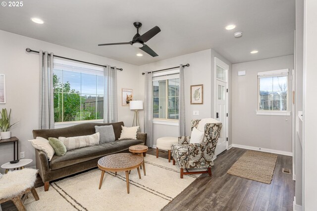 living room with a ceiling fan, baseboards, recessed lighting, and wood finished floors