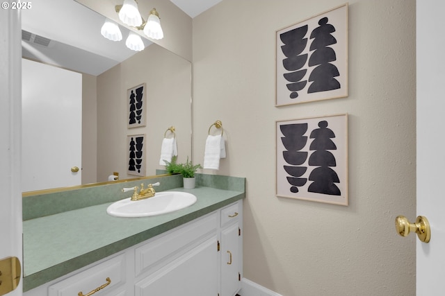 bathroom featuring visible vents and vanity