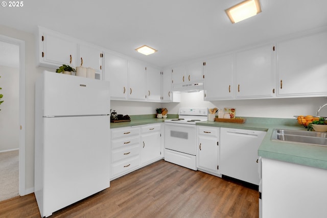 kitchen with under cabinet range hood, white appliances, a sink, white cabinets, and light wood finished floors