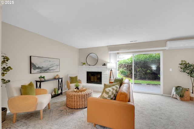 living room featuring baseboards, a wall mounted air conditioner, a fireplace, and light colored carpet