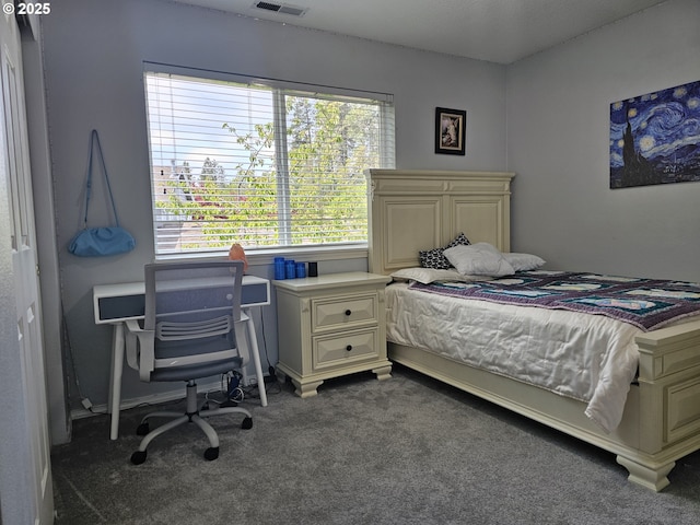 bedroom featuring multiple windows, visible vents, and carpet floors