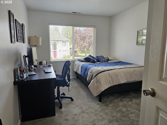 bedroom with visible vents, baseboards, and carpet floors